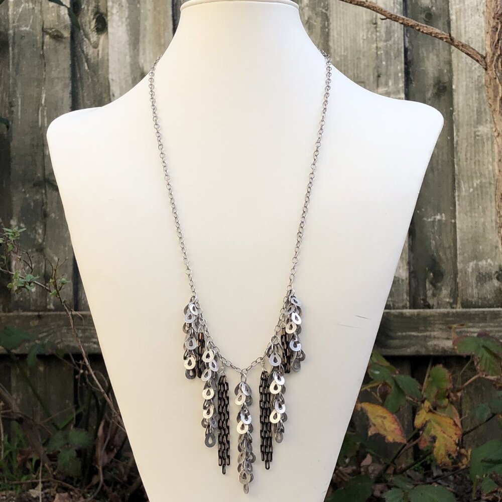 Long necklace with silver paillettes and black/gold chains